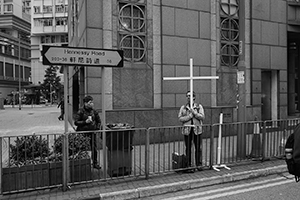 Participant holding a cross, in a pro-democracy march from Victoria Park to Central, Hennessy Road, 1 February 2015