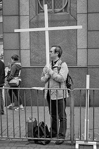 Participant holding a cross, in a pro-democracy march from Victoria Park to Central, Hennessy Road, 1 February 2015