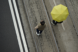 Participant with a yellow umbrella, pro-democracy march from Victoria Park to Central, Hennessy Road, 1 February 2015