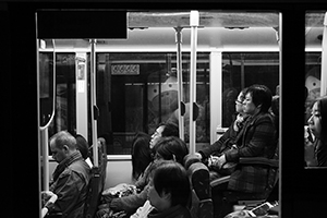 People on a bus at night, Sheung Wan, 19 February 2015