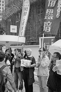 Joseph Zen facilitating fundraising for Civil Human Rights Front in the pro-democracy march from Victoria Park to Central, Queensway, 1 February 2015