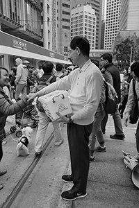 Martin Lee facilitating fundraising for the Civil Human Rights Front in the pro-democracy march from Victoria Park to Central, Des Voeux Road Central, 1 February 2015