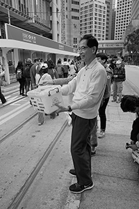Martin Lee facilitating fundraising for Civil Human Rights Front in the pro-democracy march from Victoria Park to Central, Des Voeux Road Central, 1 February 2015