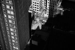 Buildings and a construction site viewed from an apartment in Sheung Wan, 2 February 2015