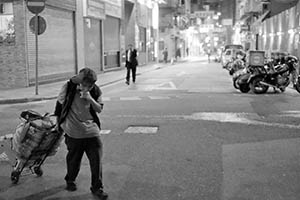 A man pulling a trolley, Sheung Wan, Hong Kong Island, 9 February 2015