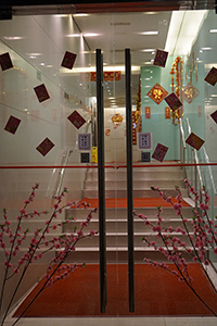 Lunar New Year decorations on the doors of a building, Sheung Wan, 9 February 2015