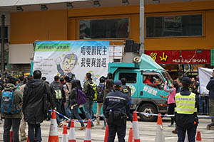 Truck with Democratic Party protest banner - on a pro-democracy march from Victoria Park to Central, Causeway Bay, 1 February 2015
