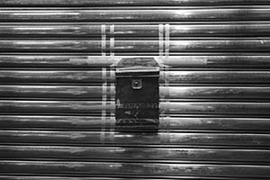 Letter box taped onto the closed shutters of a shop, Sheung Wan, 18 February 2015