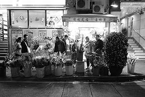 Flower shop displaying flowers on sale for Lunar New Year celebration, Wing Lok Street, Sheung Wan, 18 February 2015