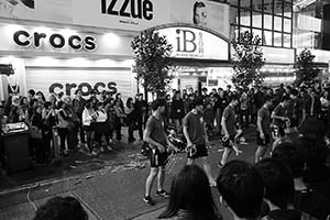 Young people performing on the street in front of Island Beverley Shopping Centre on Lunar New Year Eve, East Point Road, Causeway Bay, 18 February 2015