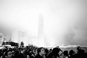 People gathering at Central harbourfront for the Lunar New Year Fireworks Display with IFC 2 and other buildings in the back, 20 February 2015