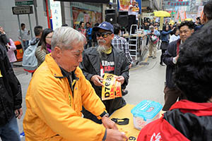 Stall beside a pro-democracy march from Victoria Park to Central, Hennessy Road, 1 February 2015