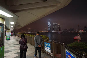 Victoria Harbour and Kowloon at night viewed from an overhead walkway in Sheung Wan, 20 February 2015