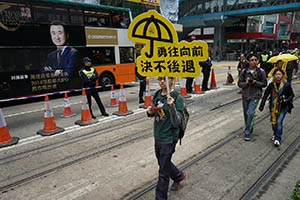 Participant with a sign on the pro-democracy march from Victoria Park to Central, Hennessy Road, 1 February 2015