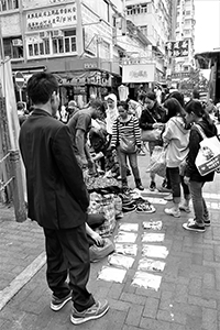 People selling shoes and other goods on the street, Sham Shui Po, 21 February 2015