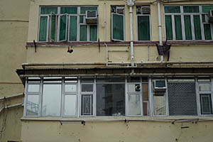 Windows of a building at the junction of Boundary Street and Lai Chi Kok Road, Sham Shui Po, 21 February 2015