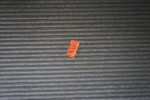 Red paper on the shutters of a closed shop, Tai Kok Tsui, 21 February 2015