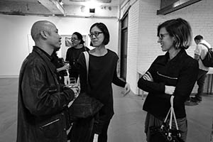 Warren Leung chatting with guests at 'Museum of the Lost', an exhibition at Blindspot Gallery, Wong Chuk Hang, 7 March 2015