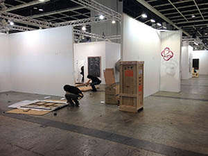 Disassembling displays on the last day of Art Basel,  Convention and Exhibition Centre, Wanchai, 17 March 2015
