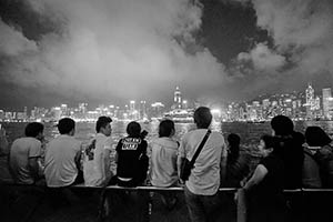 People on the waterfront at night, with a view of Victoria Harbour and Hong Kong Island, Tsim Sha Tsui, 15 May 2015