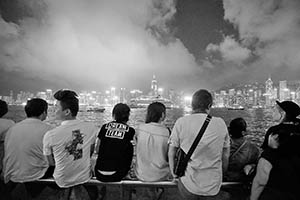 People on the waterfront at night, with view of Victoria Harbour and Hong Kong Island, Tsim Sha Tsui, 15 May 2015