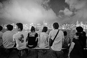 People on the waterfront at night, with a view of Victoria Harbour and Hong Kong Island, Tsim Sha Tsui, 15 May 2015