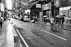 Street scene in rainy weather, Wing Lok Street, Sheung Wan, 20 May 2015