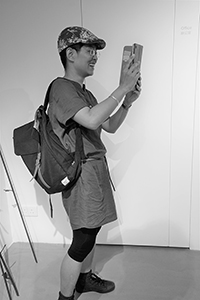 Leung Po Shan at an exhibition opening, Para Site, King's Road, Quarry Bay, 29 May 2015