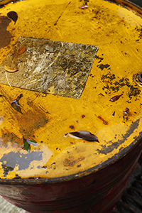 Water and dried leaves on a rusted barrel, Tai Hang, 31 May 2015