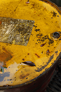 Water and dried leaves on a rusted barrel, Tai Hang, 31 May 2015