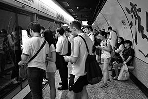 Passengers waiting in the Wanchai MTR station, Hong Kong Island, 19 June 2015