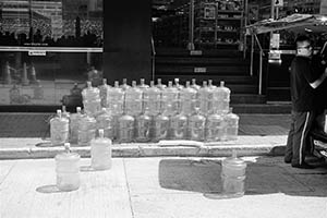 Drinking water containers on the street, Sheung Wan, 4 June 2015