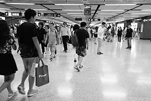 People walking inside Central MTR Station, 14 July 2015