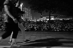 Exercising at night in Sun Yat Sen Memorial Park, Sai Ying Pun, 5 July 2015
