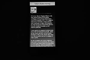 Severe weather warning from the Hong Kong Observatory on a phone, Sheung Wan, 9 July 2015