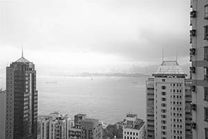 Victoria Harbour and Stonecutters Island viewed from Sheung Wan on a cloudy day, 29 August 2015
