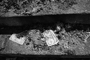 Remains of Hell money after a ritual of mourning for Banyan trees that were cut down due to public safety concerns,  Bonham Road, 22 August 2015