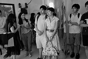Guests at the opening of 'Jungle of Desire', an exhibition by Wong Ping at Things That Can Happen, Sham Shui Po, Kowloon, 5 September 2015