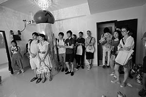 Guests at the opening of 'Jungle of Desire', an exhibition by Wong Ping at Things That Can Happen, Sham Shui Po, Kowloon, 5 September 2015