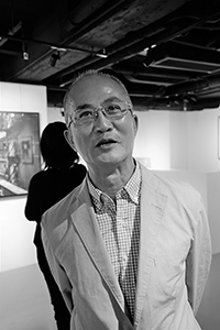 Photographer Alfred Ko,  at an exhibition opening, Ice House Street, Central, 7 October 2015