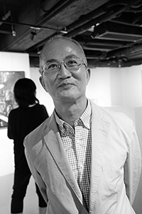 Photographer Alfred Ko,  at an exhibition opening, Ice House Street, Central, 7 October 2015