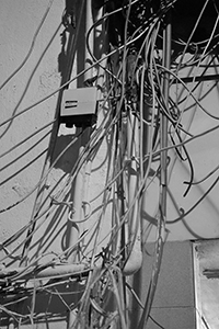 Pipes and cables on the exterior of a building, Sai Ying Pun, 28 October 2015