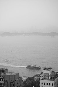 Victoria Harbour and Stonecutters Island viewed from an apartment in Sheung Wan, 1 October 2015