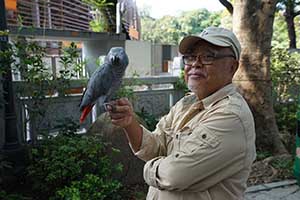 A man with his bird, Yuen Po Street Bird Garden, Mongkok,  1 November 2015