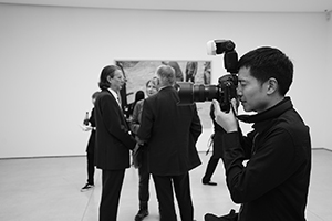 Photographer Jeff Wall (left, background) at the opening of his exhibition, White Cube Gallery, 50 Connaught Road Central, Central, 10 December 2015