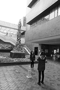 People taking photos in front of the Pillar of Shame, University of Hong Kong, Pokfulam, 20 January 2016