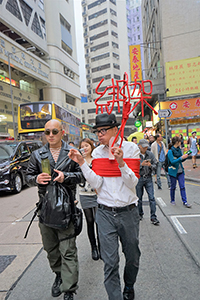 Artist Kacey Wong at a demonstration concerning booksellers who are missing (and presumed abducted illegally to the Mainland), Sheung Wan, 10 January 2016