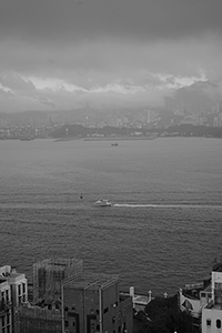 Victoria Harbour and Stonecutters Island viewed from Sheung Wan on a cloudy day, 15 January 2016