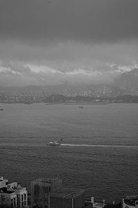 Victoria Harbour and Stonecutters Island viewed from Sheung Wan on a cloudy day, 15 January 2016