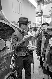Artist Kacey Wong and a collaborator making egg waffles with an artistic twist, East Point Road, Causeway Bay, 31 January 2016